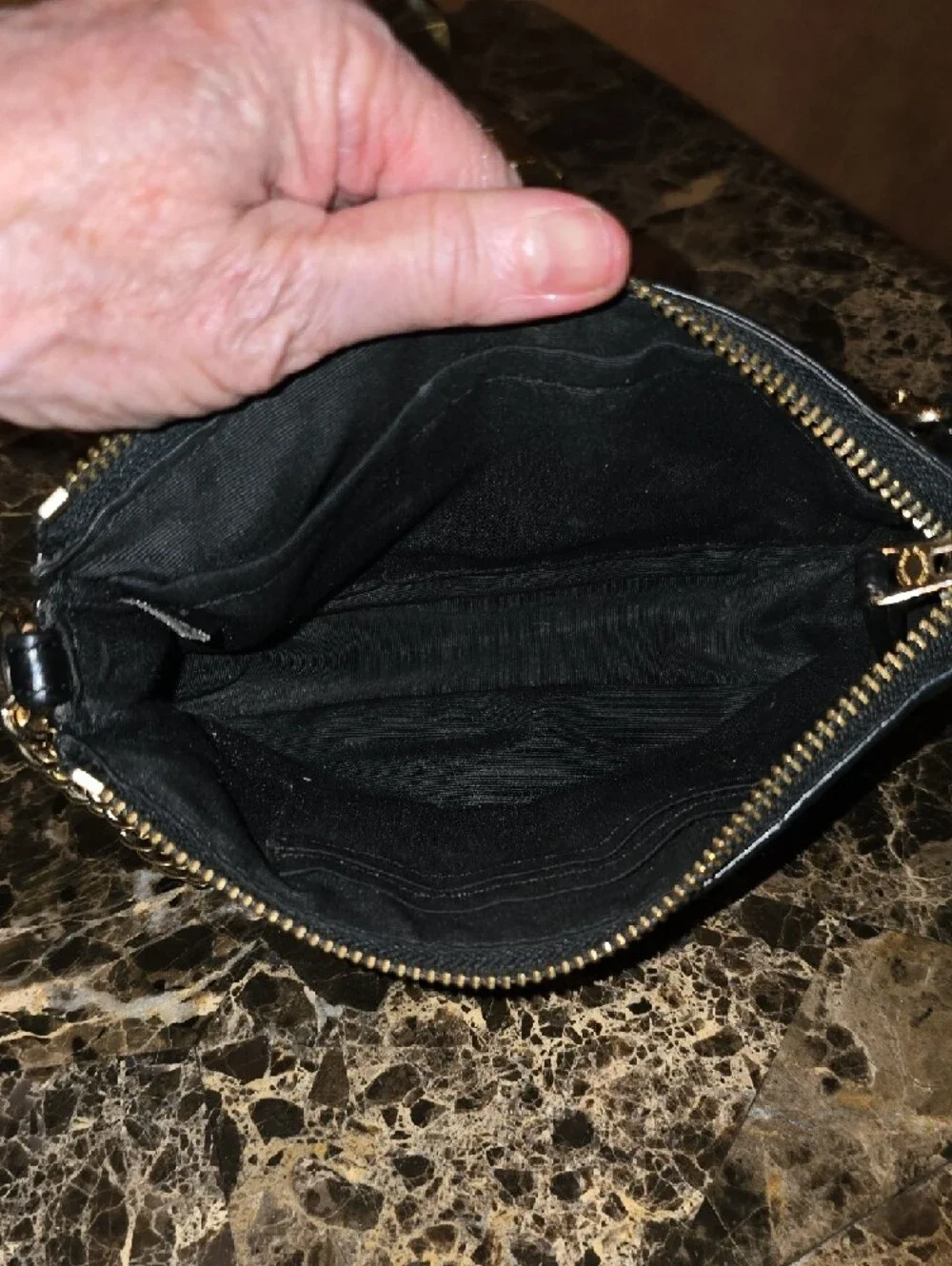 Coach Black Leather Mini Wristlet with Gold Chain 8' L x 5' H.